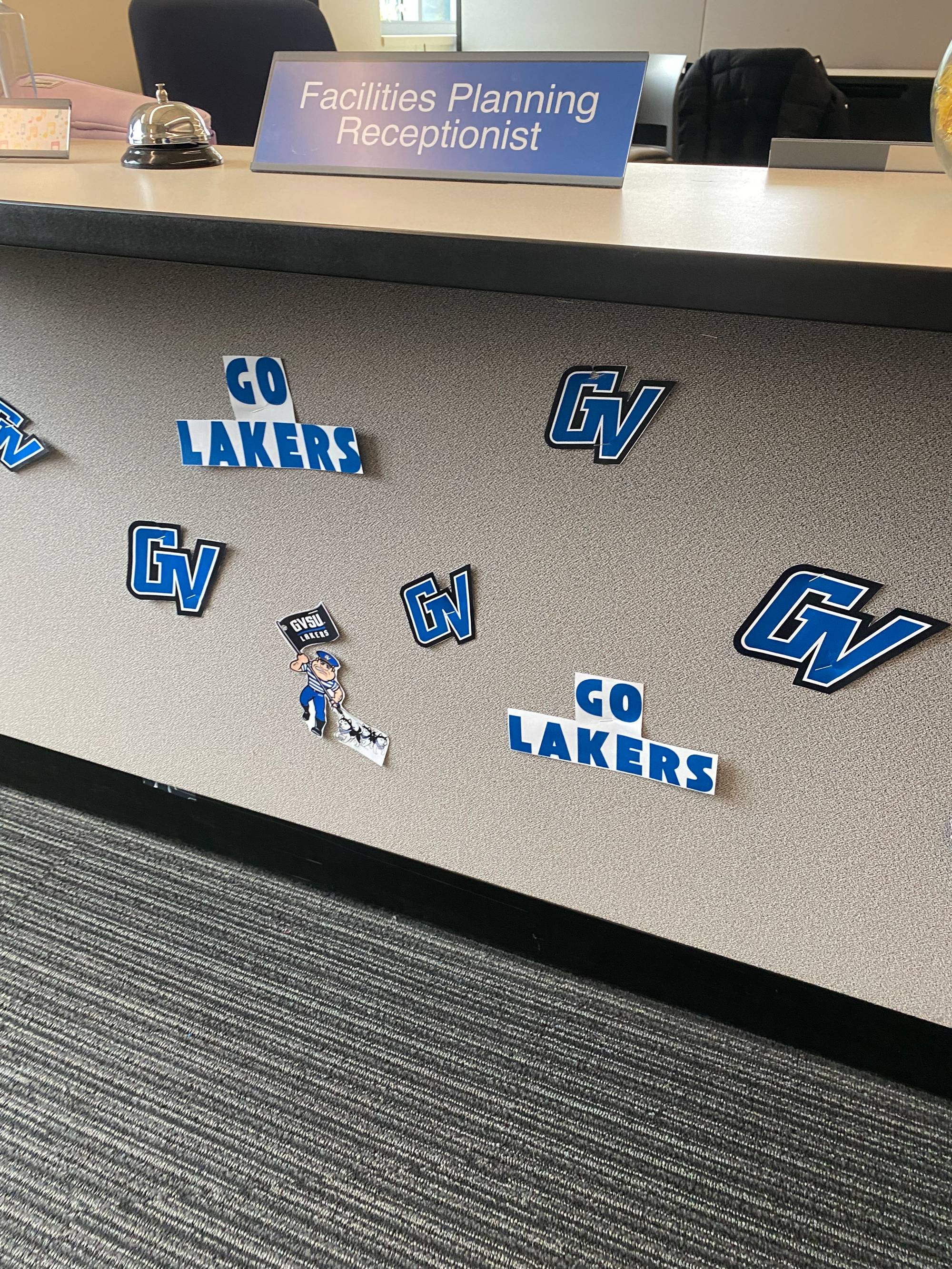Facilities Planning Homecoming decorations, "Go Lakers" and GV logo cutouts on the reception desk